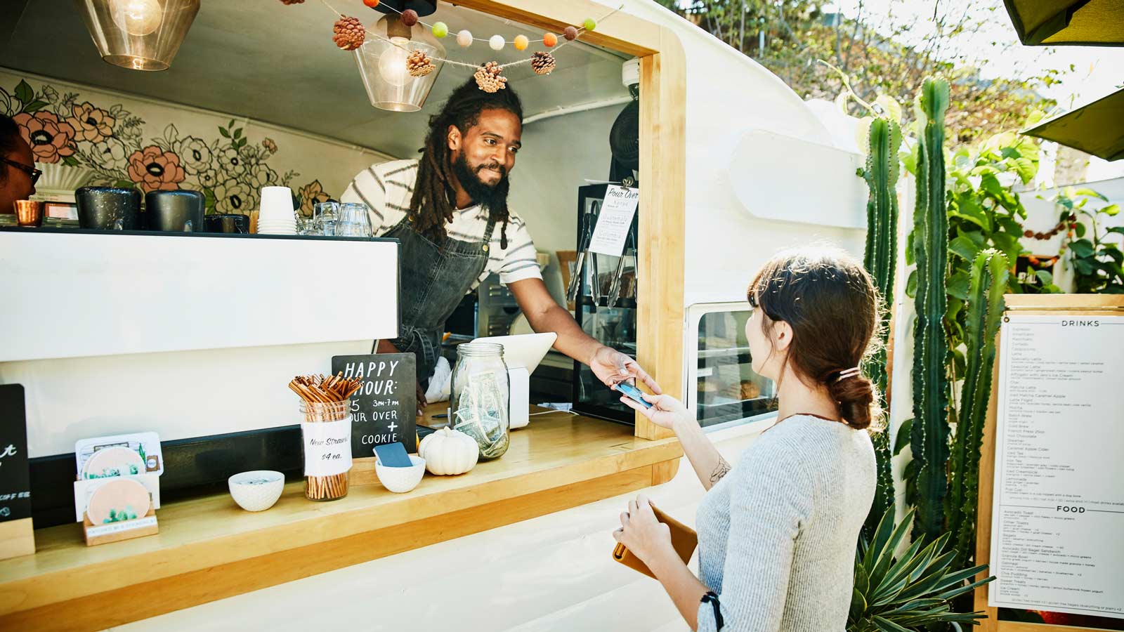Food truck merchant accepting credit card payment.